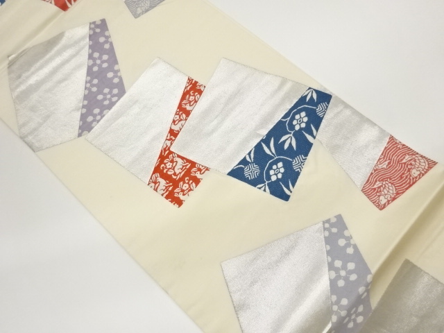 色紙に古典柄模様織出し袋帯